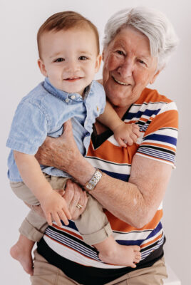 Baby Boy smiling with his great grandmother pre-First Birthday Cake Smash Photography